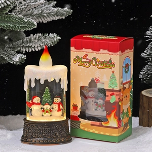 Lighted Christmas snow globe candle lantern with snowman family scene and gift box
