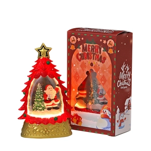 Boule à eau de Noël lumineuse avec figurine Père Noël et boîte cadeau festive