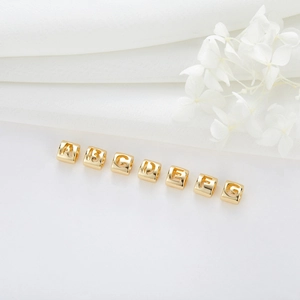 Detail showing 14K gold plated hollow alphabet cube beads for DIY jewelry making