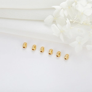 Golden twisted bean-shaped copper loose beads for DIY handmade jewelry and bracelets