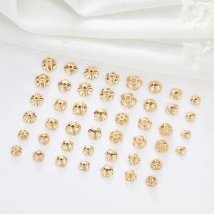 Detailed assortment of 14k gold-plated floral bead caps and spacers with micro CZ inlay