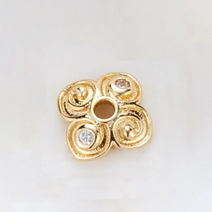 Detail showing 14k gold-plated hollow petal spacer with zircon for DIY jewelry making