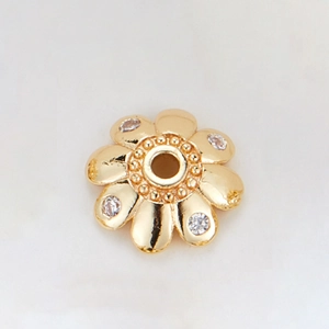 Detailed macro view of 14k gold plated flower spacer bead with sparkling cubic zirconia