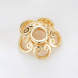 Macro view of 14k gold-plated hollow 5-petal flower bead cap with intricate filigree texture