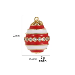 Detail view of 14k gold plated enamel egg pendant with micro-set zircon accents