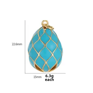 Macro detail of Fabergé-style egg pendant in sky blue enamel with gold lattice pattern