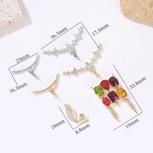 Detailed size view of vintage 14k gold plated floral and star zircon jewelry pendants