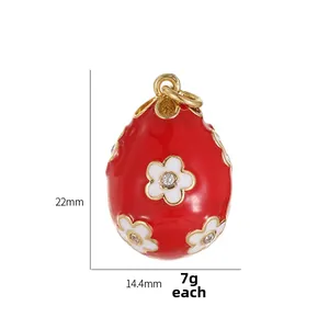 Detailed macro view of 22mm red enamel Easter egg pendant with white floral patterns