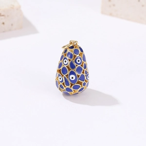 Oval evil eye pendant in 14k gold-plated copper with blue enamel openwork design