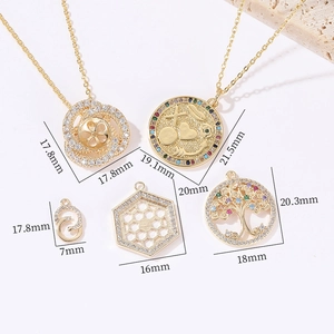 Macro shot of gold-plated geometric pendants with sparkling zircon stone settings