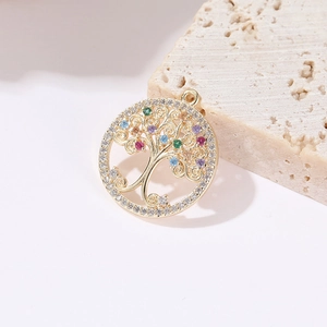 Close-up of 14k gold tree of life pendant with colorful zircons on stone base