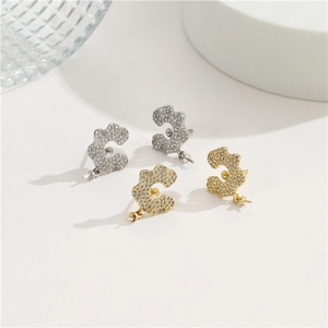 Elegant C-shaped micro-paved stud earrings with pearl base in gold and silver finish