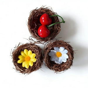 Three-piece decorative woven bird nests with artificial cherry and daisy accents
