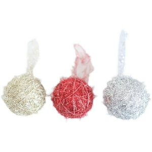 Macro detail of gold, red, and silver glitter Christmas balls with hanging silk ribbons