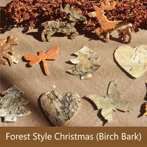 Natural birch bark Christmas ornaments including deer, tree, and snowflake on burlap