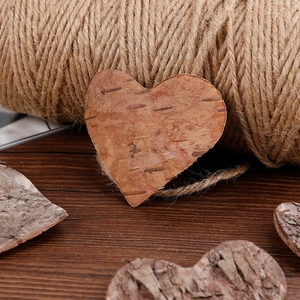 Natural birch bark heart-shaped tags with rustic wood texture for DIY Christmas decoration