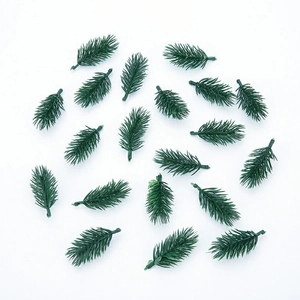 Flat lay of artificial green pine needles for DIY Christmas wreaths and holiday crafts
