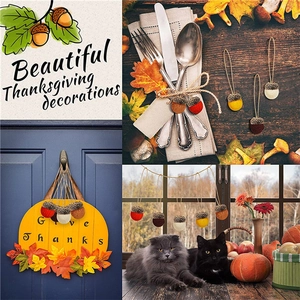 Handmade wool felt acorn hanging ornaments in assorted fall colors for Thanksgiving decor