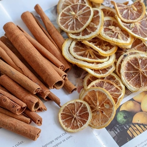 Dried lemon slices and natural cinnamon sticks for Christmas tree DIY candle decor