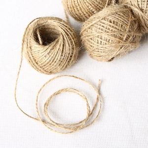 Three rolls of natural jute twine rope for decorative crafts and durable gift packaging
