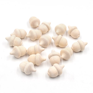 Close-up of 20 natural unfinished wooden acorns for DIY crafts and Christmas decor
