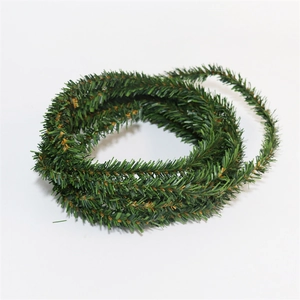 Detailed view of dark green PVC artificial Christmas pine garland with brown twig accents