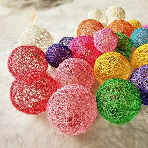 Close-up of colorful handmade woven wicker balls for wedding and home decoration