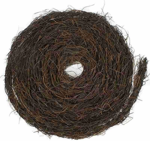 Detailed macro view of spiraled brown natural rattan vine coil for DIY wreath base