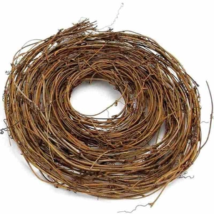 Close-up of handmade natural grapevine wreath base with dark brown rustic woody texture