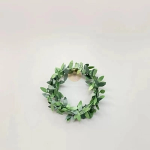 Artificial green leaf wreath garland for wedding party decoration on a clean background
