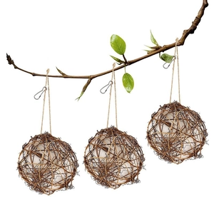 Three natural rattan balls with white stuffing and hemp ropes for bird nesting