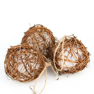 Three natural rattan bird toys with hanging hooks and white cotton filling for nesting