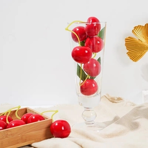 Realistic artificial cherry set with vibrant red fruit and green leaves for home decor