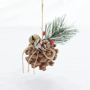 Handcrafted Christmas hanging decor with pine cones, pine needles and metal bells