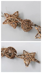 Close-up of natural vine bird toy featuring woven stars, balls, and small metal bells