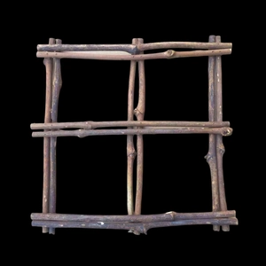 Macro detail of a square wooden vine frame with natural rustic branches for DIY decor