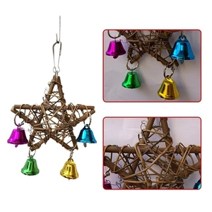 Detail view of woven star bird toy featuring natural vine textures and colorful metal bells