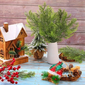 Realistic deep green PE cypress branches in a white vase with festive Christmas decor background