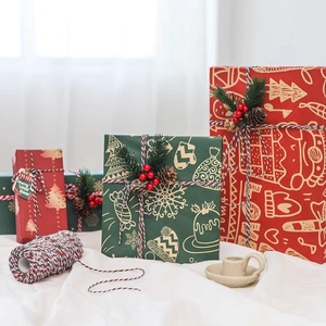 Festive Christmas gift wrapping kit with red green paper and tricolor cotton twine rolls