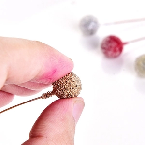 Glittery Christmas berry picks for DIY wreaths in red, gold, and silver finishes