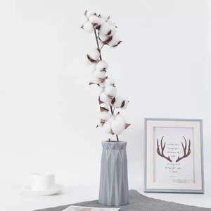 Natural dried cotton flower bouquet in a grey geometric ceramic vase for home decor