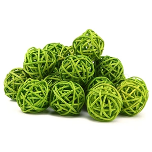 Handwoven green rattan balls for home decoration and festive Christmas window display