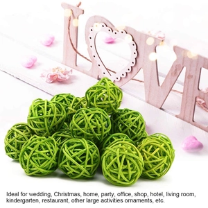 Close-up of vibrant green woven rattan balls for creative Christmas or wedding table decor