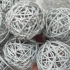 Macro view of hand-woven silver rattan decorative balls for festive wedding party decor