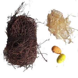 DIY handmade rattan bird nest set with natural branches, hay, and two colorful speckled eggs