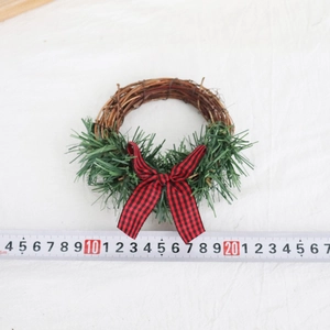 Mini Christmas wreath with green needles, rattan base and red black plaid bow 12cm