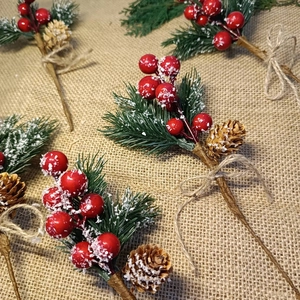 Christmas berry pine needle picks with cones and snow for festive floral decoration