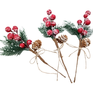 Three Christmas berry picks with snowy pine needles, pinecones, and red berries for decor