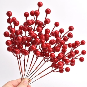 Detailed view of glossy red artificial winterberry branches for festive holiday decoration