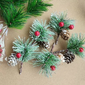 Christmas pine needle picks with red berries and pine cones for holiday DIY decor
